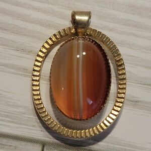 R7 Crimped Gold-tone Banded Carnelian Pendant